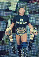 The Miz holding both United States and Unified Tag Team Championship