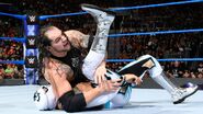 Corbin tries pinning the challenger Sin Cara