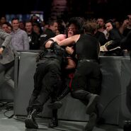 Ambrose and Rollins spear Kane through the barricade