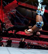 Ambrose suplex Kingston off the turnbuckle