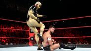 Goldust taking a kick to Balor from behind