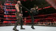 Reigns giving Strowman a big boot