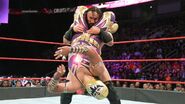 Gran Metalik performing a hurricanrana on Neville