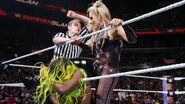 Natalya using the rope against Naomi