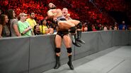 Orton drops Rusev onto the barricade