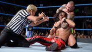 Nakamura in a headlock from Orton