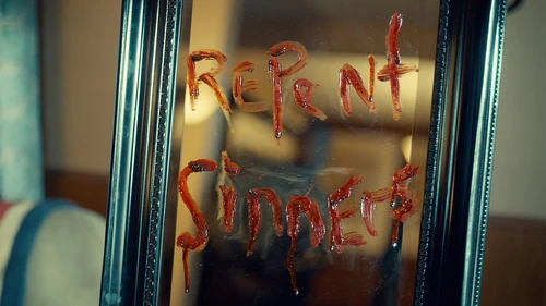 Hamilton's message "Repent Sinners" on a mirror