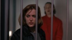 Dana Scully is watched by Luther Lee Boggs.jpg