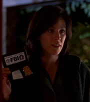 Monica Reyes showing badge