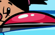 yadina looking at a big red button