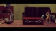 The briefcase containing Asaru.