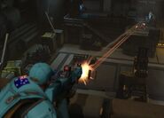 A Base Security officer fires at a Sectoid in the Mech Bay.