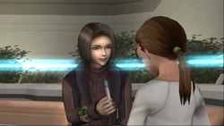 Juli gives Abel a pen to draw with.