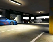 Early garage. The unfinished Devil DB9 and the pile of wheels can be seen.