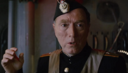 Michael Medeiros as Political Officer
