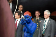 Mystique points the gun at Magneto