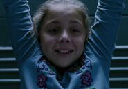 Makenzie Vega as Prison Truck Little Girl
