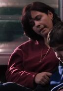 Cheryl De Luca as Mother on Train