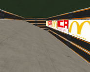 After driving on the straight start road, the player will come into this area. This area is based on a similar area in a currently unidentified track.