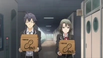 Hachiman helping Meguri carrying her boxes.