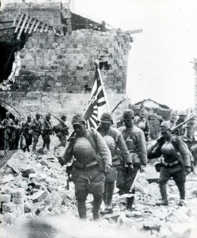 Japanese-troops-in-rubble-of-village