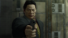 Kanai aims at Akiyama from calling the 999.