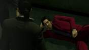 Majima wakes Nishitani after slamming his back with Majima's right foot