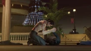 Makoto unconscious and bleeding in front of grieving Majima.