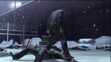 Saejima stomps Kugihara's wrist harder.png