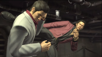 Akiyama kicks Kiryu.png