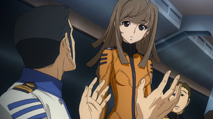 Yuria questions Sanada on the Wave motion gun.