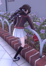 Itsumi watering some flowers.