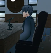 The judge's model side view, sitting on a chair.