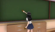 Horuda cleaning the chalkboard at Classroom 2-2.