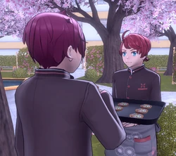 Banri giving food to a .