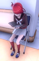 Yui reading by the shoe lockers.