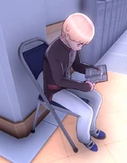 Sota reading by the shoe lockers.