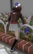 Honoka watering some flowers.