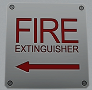 Sign indicating a fire extinguisher's location. July 12th, 2016.