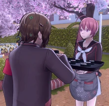 AikaGivingFoodToAStudent