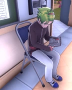 Hayato reading by the shoe lockers.