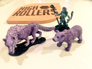 Miniatures of Elora (clockwise from left: dire wolf, Elora, bear), pictured alongside a fan-made High Rollers D&D coaster