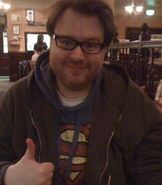 Another photo of Simon wearing his famous Superman hoodie.