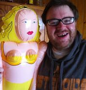 Simon and the blow up doll that Zach gave him.