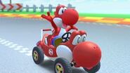 Red Yoshi driving a kart.