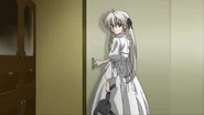 Sora glancing back at Haruka in their kitchen.