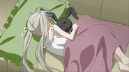 A younger Sora napping with her stuffed bunny.
