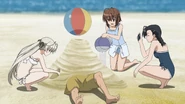 Sora and Akira Amatsume burying Ryouhei Nakazato in sand while Kozue Kuranaga records.