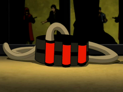 's wrist-mounted canister of Venom, with hose for attaching to the back of his head.