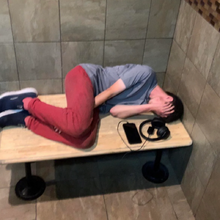 Daniel Larson sleeping in a public bathroom